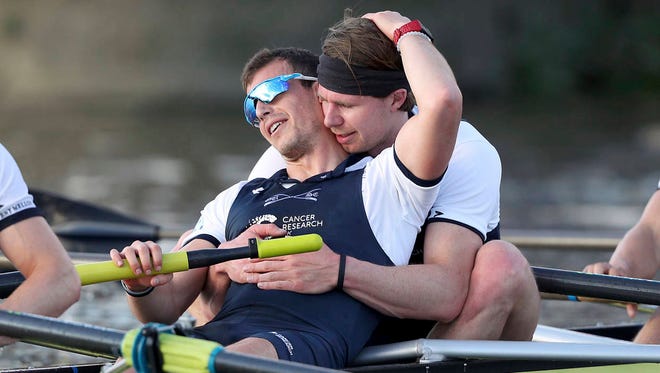 Oxford Men’s Michael Disanto, foreground and Olivier Siegelarr celebrate their victory after the Men’s Boat Race against Cambridge on the River Thames on Sunday in London. (Associated Press)