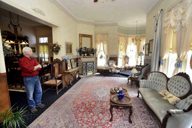 Sunbright Manor owner Reese Orlosky stands in one of the spacious parlors at the historic home in DeFuniak Springs. The home was built in 1886 and was later the home of Florida Gov. Sydney Catts. [NORTHWEST FLORIDA DAILY NEWS / DEVON RAVINE]
