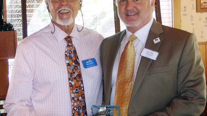 Outgoing Westlake Chamber of Commerce board member Rene Campos of MMP receives an appreciation award for service from Chairman Tim Coffey of Edward Jones at the March 21 luncheon at the County Line on the Hill. CONTRIBUTED
