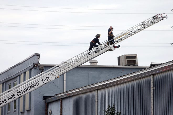 Crews work at the scene after a boiler exploded at a roof of a St. Louis box company and flew before crashing through the roof of a nearby laundry business, Monday, April 3, 2017. Authorities said several people were killed as a result of the explosion. THE ASSOCIATED PRESS