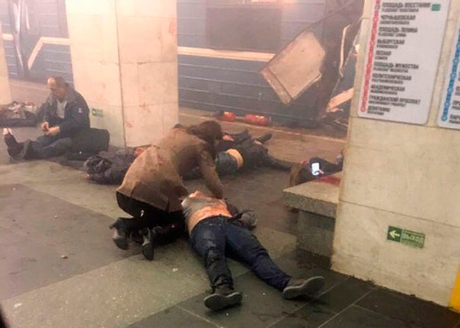 Blast victims lie near a subway train hit by a explosion at the Tekhnologichesky Institut subway station in St.Petersburg, Russia, on Monday.