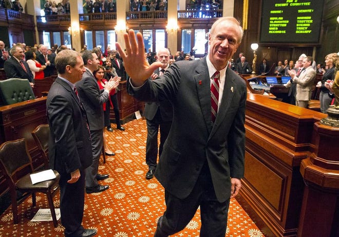 In this Feb. 15 file photo, Gov. Bruce Rauner acknowledges Republican lawmakers as he approaches the dais to deliver his budget address to a joint session of the General Assembly at the Capitol in Springfield. GATEHOUSE MEDIA ILLINOIS FILE PHOTO