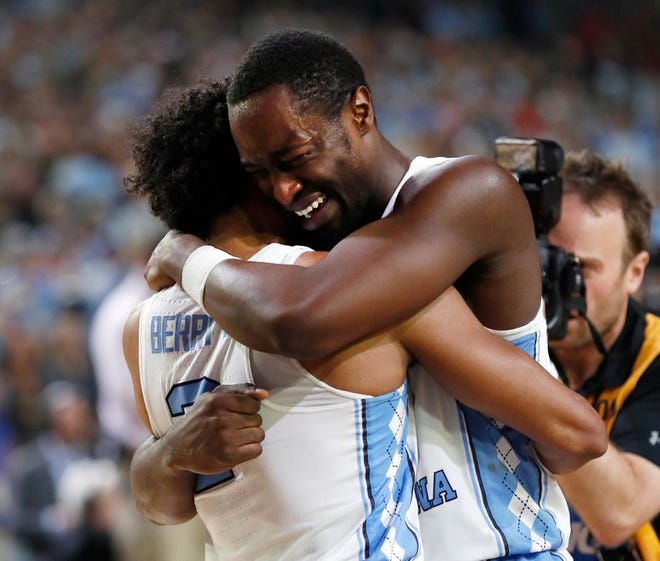 North Carolina's Theo Pinson, right celebrates with Joel Berry II after winning the national championship game.