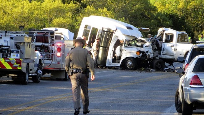 Authorities investigate after a deadly crash involving a bus carrying church members and a pickup truck on U.S. 83 outside Garner State Park in northern Uvalde County last week. The group of senior adults from First Baptist Church of New Braunfels was returning from a retreat when the crash occurred, a church statement said. (Zeke MacCormack/The San Antonio Express-News via AP)