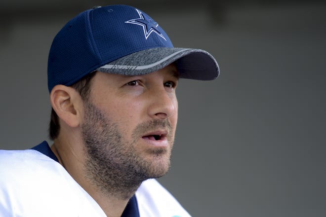 Dallas Cowboys quarterback Tony Romo talks to reporters at the end of practice on Aug. 1, 2016, in Oxnard, Calif. Romo is retiring and moving to the broadcast booth with CBS. [AP Photo / Gus Ruelas, File]