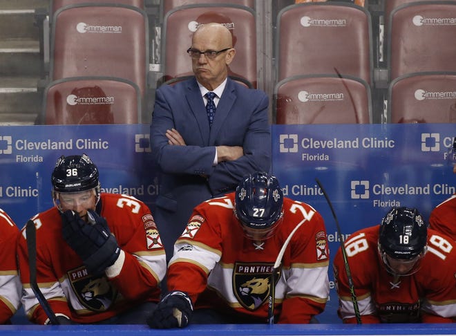 Florida Panthers general manager and interim head coach Tom Rowe looks on during the second period of an NHL game against the Ottawa Senators on Jan. 31 in Sunrise. The Panthers have decided interim coach Tom Rowe's stint will end when their season does Sunday, a person with knowledge of the situation told The Associated Press. [AP Photo / Wilfredo Lee, File]