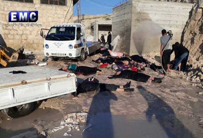 This photo provided by the Syrian anti-government activist group Edlib Media Center, which has been authenticated based on its contents and other AP reporting, shows victims of a suspected chemical attack, in the town of Khan Sheikhoun, northern Idlib province, Syria.