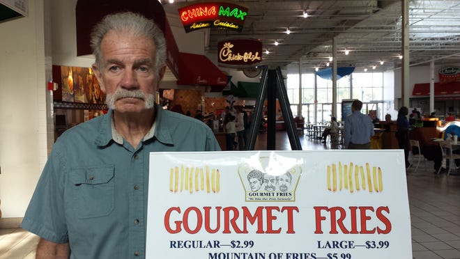 The Rev. Terry Jones stands in front of his Fry Guys Gourmet Fries stand in the food court at the DeSoto Square Mall. [Herald-Tribune archive / 2015 / Chris Anderson]