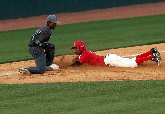 Nicholls State University’s Quade Smith slides into third base in front of Mississippi Valley State’s Chris McWright on Wednesday night at Raymond E. Didier Field in Thibodaux. [ABBY TABOR/STAFF – HOUMATODAY.COM/DAILYCOMET.COM]