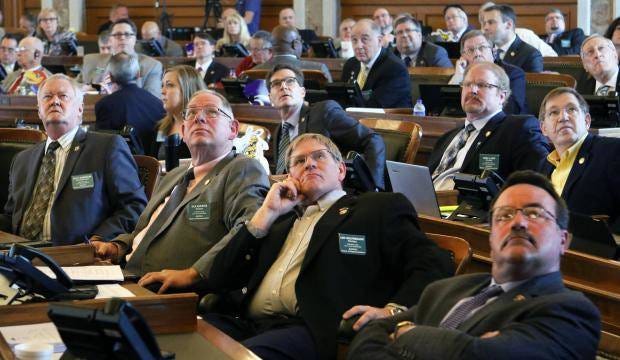 Kansas House members watched the vote board Monday as the House sustained Gov. Sam Brownback’s veto of Medicaid expansion. (Thad Allton/The Capital-Journal)