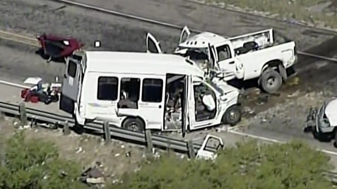 This aerial image made from a video provided by KABB/WOAI shows a deadly crash involving a van carrying church members and a pickup truck on U.S. 83 outside Garner State Park in northern Uvalde County, Texas, Wednesday, March 29, 2017.