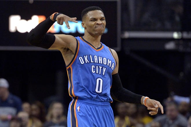 Oklahoma City Thunder guard Russell Westbrook (0) gestures after scoring a 3-pointer during the second half of the team's game against the Memphis Grizzlies on Wednesday in Memphis, Tenn. [AP Photo / Brandon Dill]