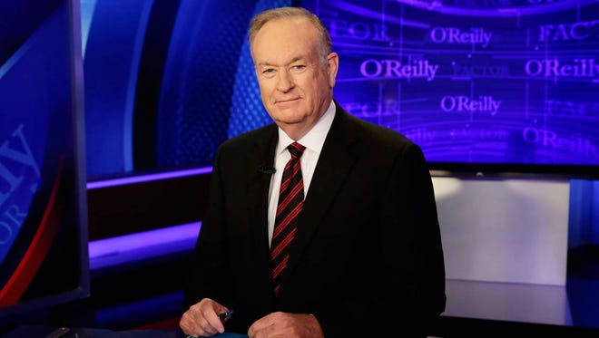 In this Oct. 1, 2015 file photo, host Bill O’Reilly of “The O’Reilly Factor” on the Fox News Channel, poses for photos in the set in New York. (AP Photo/Richard Drew, File)