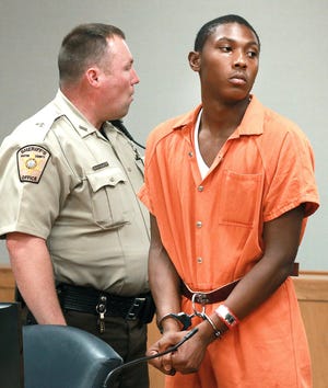 Darvon Malik Fletcher, right, is shown during his first court appearance hearing Wednesday afternoon at the Gaston County Courthouse. Fletcher, 18, is charged with first-degree murder in the shooting death of 14-year-old Taylor Sotera Smith at Riverfront Park in Mount Holly on Monday, April 3. [JOHN CLARK/THE GAZETTE}