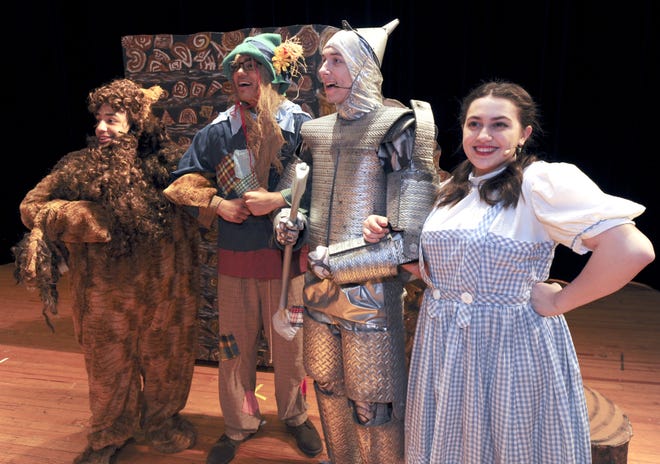 The Cowardly Lion, Scarecrow, Tin Man and Dorothy Gale played by Issaac Lake, Vishal Forde Shamus Andrek and Tina DeLano are off to see the Wizard during dress rehearsal for "The Wizard of Oz" at Pocono Mountain East High School. [Keith R. Stevenson/Pocono Record]