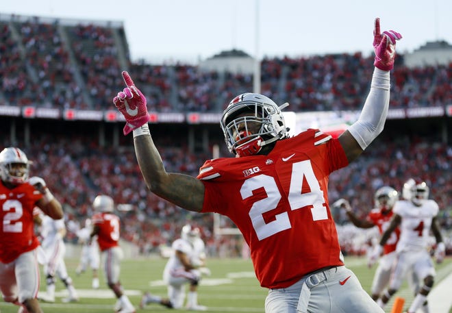 Ohio State Buckeyes safety Malik Hooker (24) celebrates an interception of Indiana Hoosiers quarterback Richard Lagow (21) during the fourth quarter of the NCAA football game at Ohio Stadium in Columbus on Oct. 8, 2016. (Adam Cairns / The Columbus Dispatch)