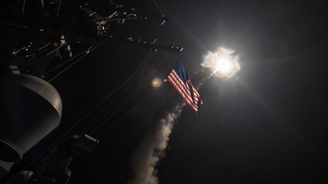 In this handout provided by the U.S. Navy, the guided-missile destroyer USS Porter fires a Tomahawk land attack missile on April 7, 2017 in the Mediterranean Sea. The USS Porter was one of two destroyers that fired a total of 59 cruise missiles at a Syrian military airfield in retaliation for a chemical attack that killed scores of civilians this week. The attack was the first direct U.S. assault on Syria and the government of President Bashar al-Assad in the six-year war there. (Photo by Ford Williams/U.S. Navy via Getty Images)