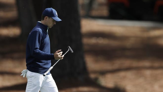Jordan Spieth, walking up the second hole during the first round of the Masters on Thursday, has a tough slog ahead from 41st place, 10 shots behind the leader. MATT SLOCUM/ASSOCIATED PRESS
