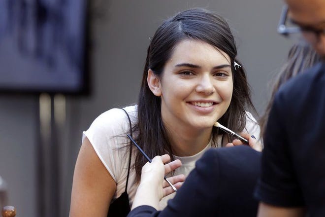 (File) In this Wednesday, Sept. 14, 2016, photo, model Kendall Jenner has makeup applied backstage before the Michael Kors Spring 2017 collection is modeled during Fashion Week, in New York. Pepsi recently pulled an ad, featuring Jenner, that was widely criticized and mocked on social media for appearing to trivialize protests for social justice causes.