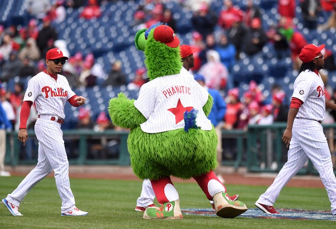 The Phillie Phanatic greets players before the Phillies' home opener against the Washington Nationals at Citizens Bank Park in Philadelphia on Friday, April 7, 2017.