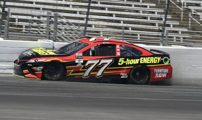 Erik Jones hits the wall coming out of Turn 4 during a during a practice session for Sunday's Monster Energy Cup Series auto race at Texas Motor Speedway in Fort Worth, Texas, on Friday. [AP Photo / Larry Papke]