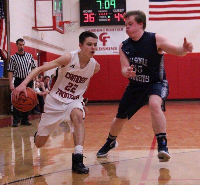 Camden-Frontier's Brandt McNeil drives past Hillsdale Academy's Nolan Sullivan in a varsity basketball game during the 2016-17 season. [FILE PHOTO]