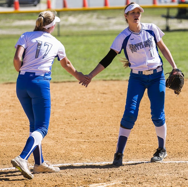 Belleview's Autumn Oglesby and Belleview's Breana LaClair (11) give each other a slap after making an out against Seabreeze. The 17th Annual Doc4Live Showdown began Friday at Shocker Park in Ocala. Belleview played Seabreeze and won 8-1 while Forest played Countryside and lost 11-2 on Friday afternoon. MORE PHOTOS AT OCALA.COM [Doug Engle/Staff photographer]