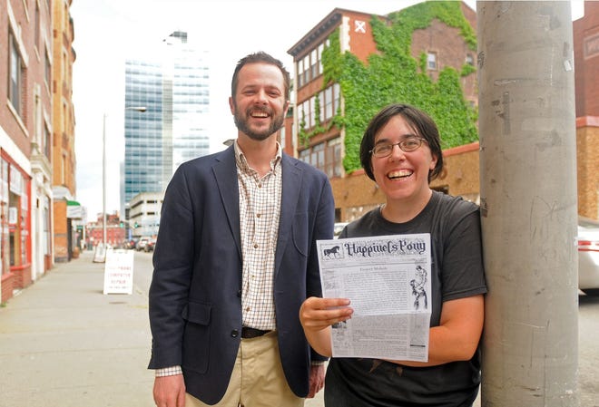 Happiness Pony co-editors Mike Benedetti and Jen Burt with an issue of the 'zine, in 2014. [T&G Staff/Steve Lanava]