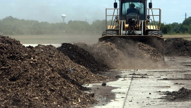 A bulldozer prepares a compost pile at the Hornsby Bend plant in 2011. The city’s sludge-based Dillo Dirt has piled up without a contractor who can haul it away. Kelly West / AMERICAN-STATESMAN