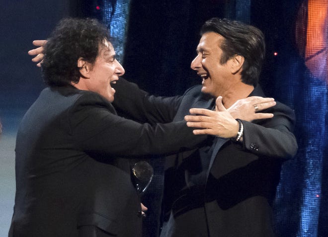 Inductees Neal Schon, left, and Steve Perry from the band Journey embrace at the 2017 Rock and Roll Hall of Fame induction ceremony at the Barclays Center on Friday, April 7, 2017, in New York. (Photo by Charles Sykes/Invision/AP)