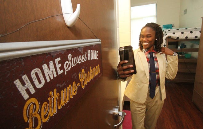 Ebone Sturrup, a junior, snaps a dorm room selfie in the new Thomas and Joyce Hanks Moorehead Residental Life Center at Bethune-Cookman University. Dorm rooms are designed as suites so that two rooms share a private bathroom. News-Journal/David Tucker