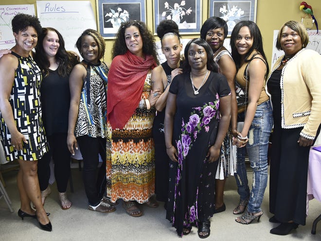 The Patterson Foundation's Kelli Karen, a consultant and facilitator for the “Mind in the Making” program in Sarasota, here with “Team Wisdom,” who completed their course in learning about empathy, communication, critical thinking, goal-setting and more. Next to Karen is Elysia Krueger, 19, Phoebe Mitchell, 32, Bouchra Nouri, 37, Sable Walker, 28, Genika Farlin, 33, Sandra Gadison, 51, Kellie Bowens, 28, and April Y. Glasco, CEO and founder of Second Chance Last Opportunity, New Life Center. [Herald-Tribune staff photo / Thomas Bender]