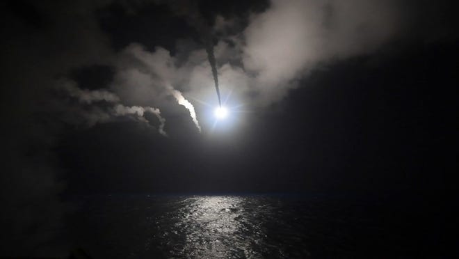 In this file image provided on Friday, April 7, 2017 by the U.S. Navy, the guided-missile destroyer USS Porter (DDG 78) launches a tomahawk land attack missile in the Mediterranean Sea. (Mass Communication Specialist 3rd Class Ford Williams/U.S. Navy via AP, File)