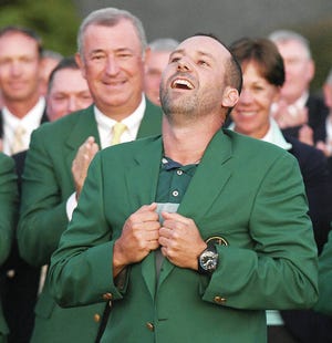 Sergio Garcia gets the feeling of his green jacket after winning the Masters Tournament on Sunday. Garcia won the tournament by defeating Justin Rose in a one-hole playoff on the 18th green at Augusta National Golf Club in Augusta, Ga. Jeff Siner/Charlotte Observer/TNS