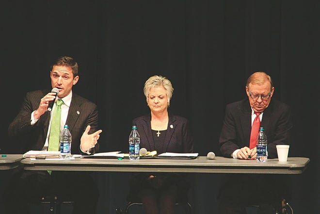 State Rep. Travis Dunlap, left, answers a question from the audience during an Bartlesville Public Schools-sponsored education forum Friday at the Bartlesville High School Fine Arts Center. Dunlap, Sen. Julie Daniels, center, and Rep. Earl Sears, right, spoke on topics related to Oklahoma education. Nathan Thompson/Examiner-Enterprise