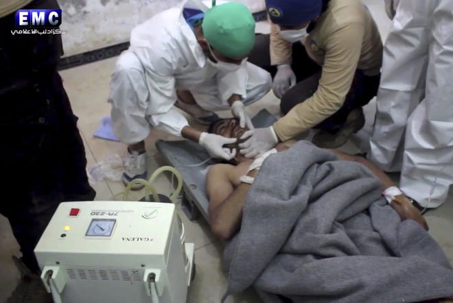 This frame grab from video provided on Tuesday April 4, 2017, by the Syrian anti-government activist group Edlib Media Center, that is consistent with independent AP reporting, shows a victim of a suspected chemical attack as he receives treatment at a makeshift hospital, in the town of Khan Sheikhoun, northern Idlib province, Syria. A senior U.S. official says the U.S. has concluded that Russia knew in advance of Syria's chemical weapons attack last week. THE ASSOCIATED PRESS