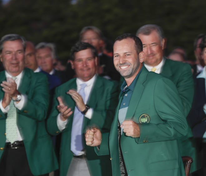 Sergio Garcia, of Spain, celebrates at the green jacket ceremony after the Masters golf tournament Sunday, April 9, 2017, in Augusta, Ga. A similar style jacket, confirmed authentic by Augusta National, sold at auction for $139K.