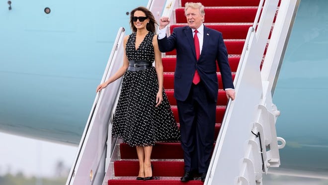 President Donald J. Trump arrives on Air Force One at Palm Beach International Airport in West Palm Beach, Fla., with his wife Melania on April 6, 2017. (Richard Graulich / The Palm Beach Post)