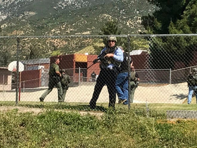 Emergency personnel respond to a shooting inside North Park School Elementary School on Monday, April 10, 2017, in San Bernardino, Calif. (Rick Sforza/Los Angeles Daily News via AP)