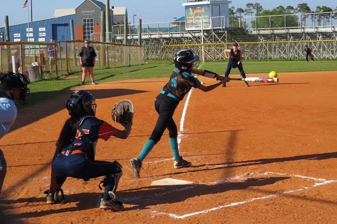 Destin's Aylanni Enriquez puts the bat on the ball against Bruner Monday afternoon. Enriquez connected for a hit in the third inning in the 13-0 win. [LYNN TREADWAY/SPECIAL TO THE LOG]