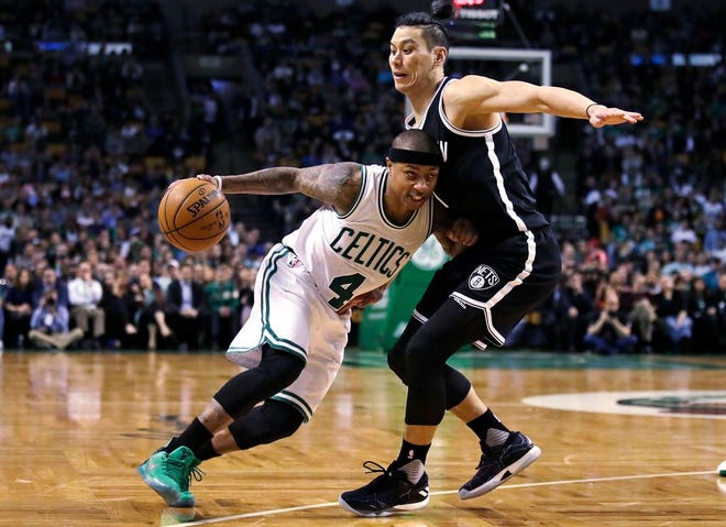 Boston Celtics guard Isaiah Thomas (4) tries to drive past Brooklyn Nets guard Jeremy Lin during the second half of an NBA basketball game in Boston, Monday, April 10, 2017. Thomas scored 27 points as the Celtics defeated the Nets 114-105.