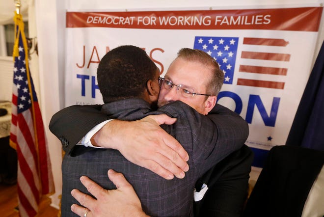 Democrat James Thompson gets a hug from supporter Djuan Wash at the Murdock Theatre in Wichita, Kan., Tuesday, April, 11, 2017. Thompson came up short in his bid to beat republican Ron Estes in a special election to replace current CIA director, and former U.S. Rep Mike Pompeo in the Kansas 4th congressional district. (Travis Heying/The Wichita Eagle via AP)
