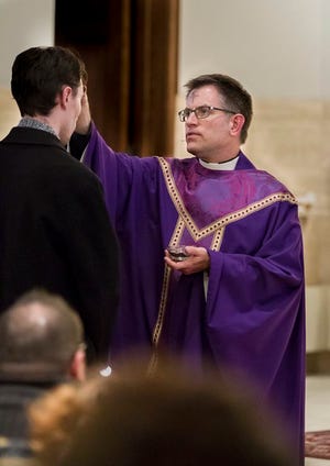 Monroe News file photo 
Rev. James Smalarz, pastor of St. John the Baptist Catholic Church, Monroe, for the past seven years, is moving to a new parish this summer.