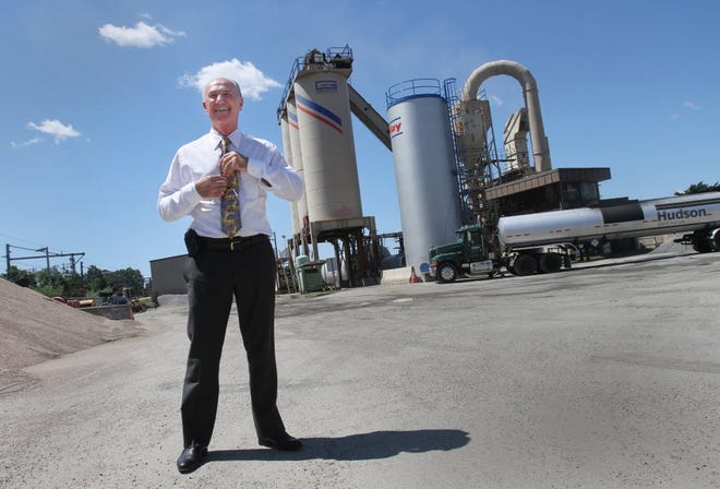 Michael V. D'Ambra, president of D'Ambra Construction Co., stands near his family's asphalt plant in Warwick in 2012, on property that is now being redeveloped for a Hyatt Place hotel. [The Providence Journal, file]