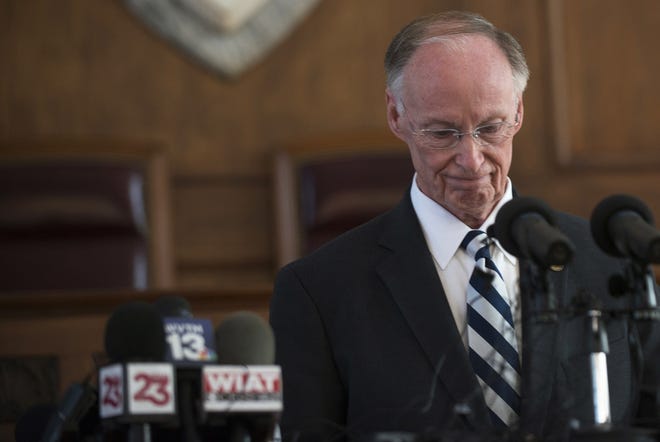 Former Alabama Governor Robert Bentley speaks to the press after officially resigning on Monday. [The Montgomery Advertiser via AP/ [Albert Cesare]