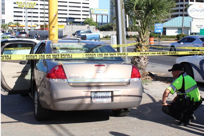 Authorities said this gold-colored Chevy Impala, which crashed into a pole outside the Coyote Ugly Saloon in Panama City Beach, was connected to a recent shooting. Tourism officials are expressing their concerns about the recent violence on the Beach. [ERYN DION/NEWS HERALD FILE]