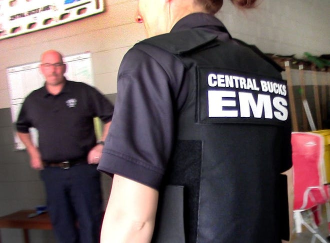 Kimberly Pekach, of Central Bucks Emergency Medical Services, displays one of the armored vests being distributed to each staff member. Several EMT and ambulance crews are outfitting their members with protective gear.