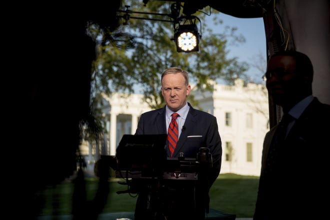 White House press secretary Sean Spicer prepares to go on cable news on the North Lawn of the White House, Tuesday, April 11, 2017, in Washington. Spicer is apologizing for making an "insensitive" reference to the Holocaust in earlier comments about Syrian President Bashar Assad's use of chemical weapons. THE ASSOCIATED PRESS