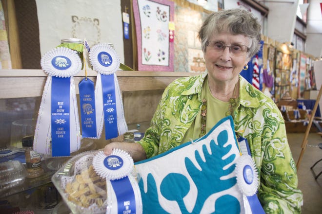 Dr. Marnell LaRoe Hayes shows off her four best in show creations at the Lake County Fair on Wednesday. She has been competing in fair exhibits since she was 12 years old. [CINDY DIAN / CORRESPONDENT]