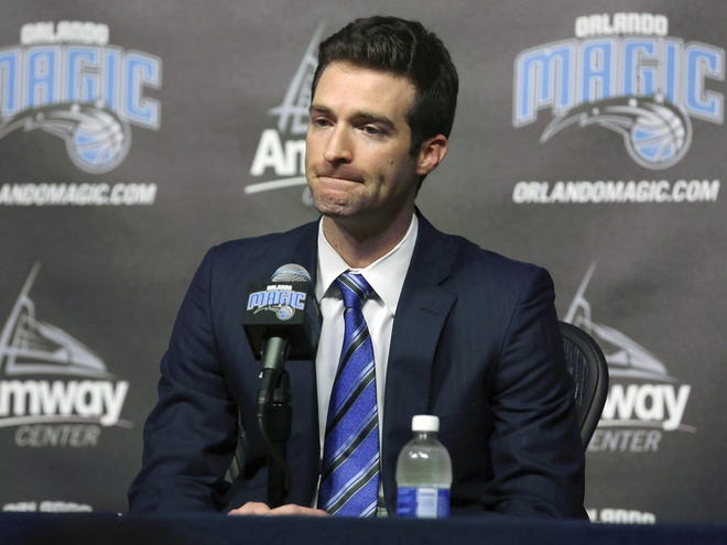 Orlando Magic general manager Rob Hennigan pauses to answer a question during a news conference on Feb. 5, 2015, in Orlando. The Magic fired Hennigan after missing the postseason for five straight seasons. [Stephen M. Dowell / Orlando Sentinel via AP, File]